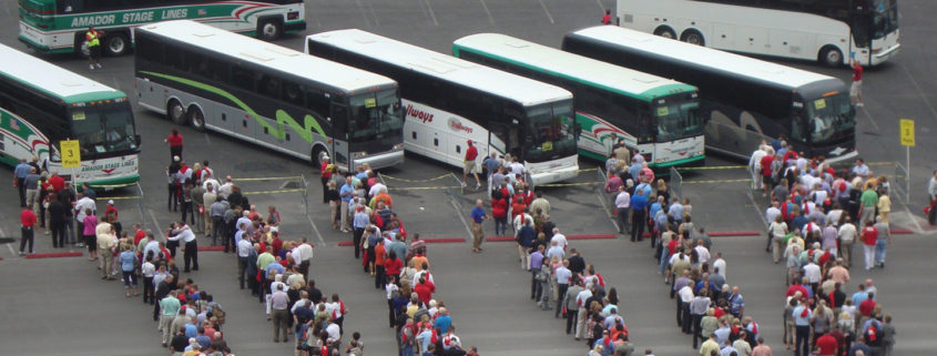 stewart transportation solutions files people onto buses for large event